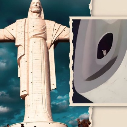 Котка почиваща на върха на паметника Кристо де ла Конкордия