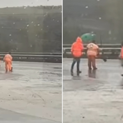 Действията на служители които запълват дупки на пътното платно –